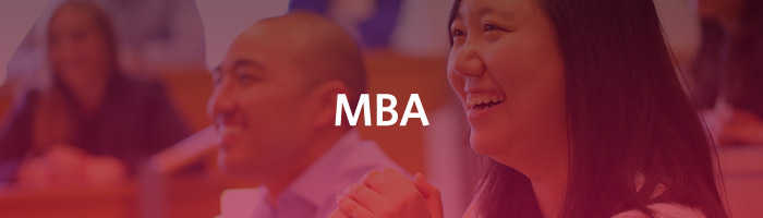 People smiling and engaging in what appears to be a classroom setting with the word "MBA" overlaid.